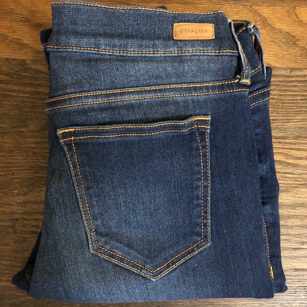 Sneak peek distressed skinny jeans